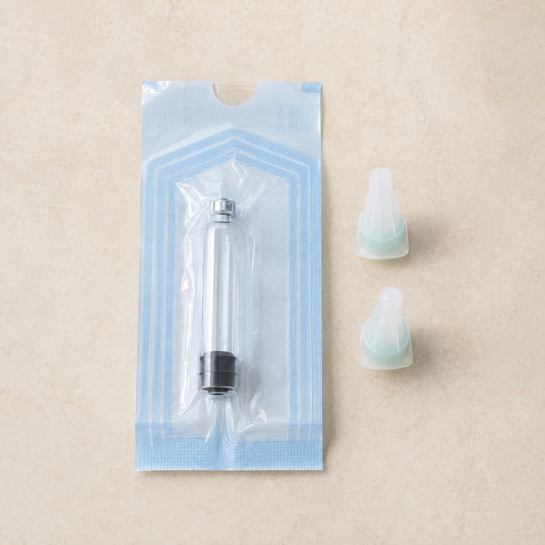 Sealed empty-cartridge package beside capped pen-tip units