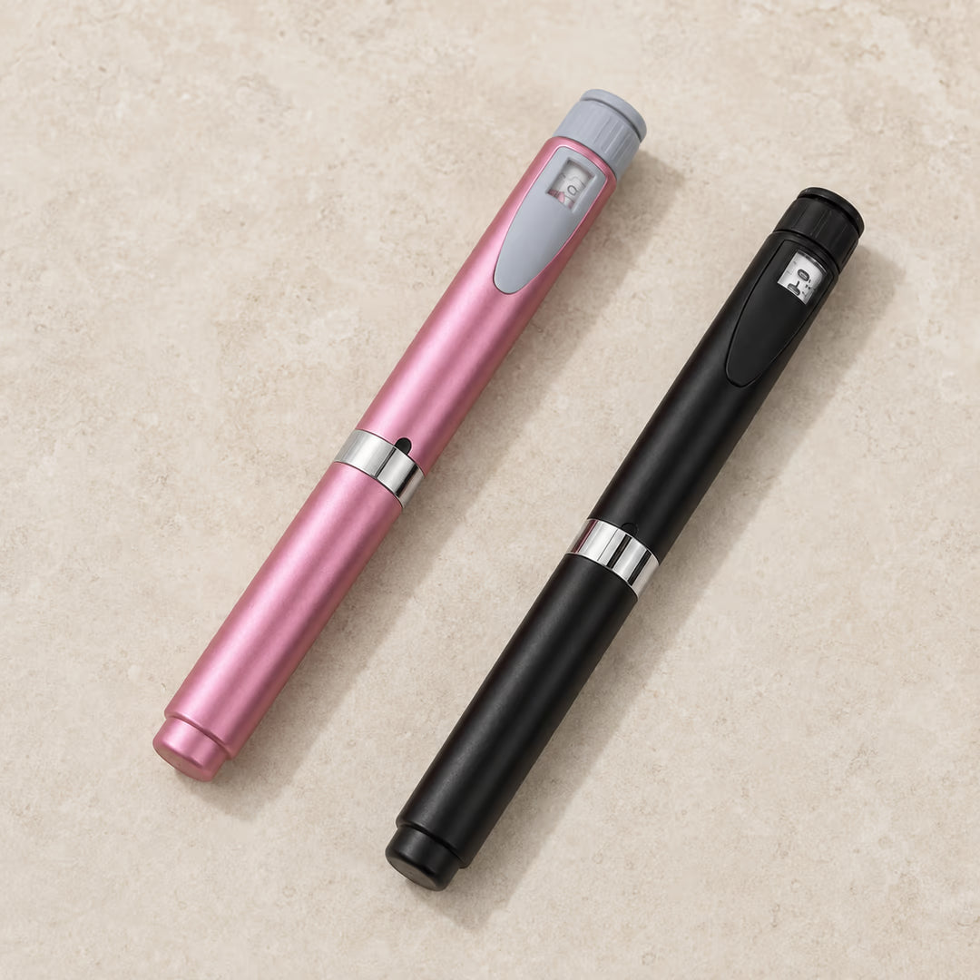 Pink and black reusable pens arranged diagonally